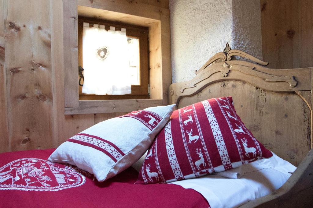 Postel nebo postele na pokoji v ubytování Chalet Del Cuore Guesthouse