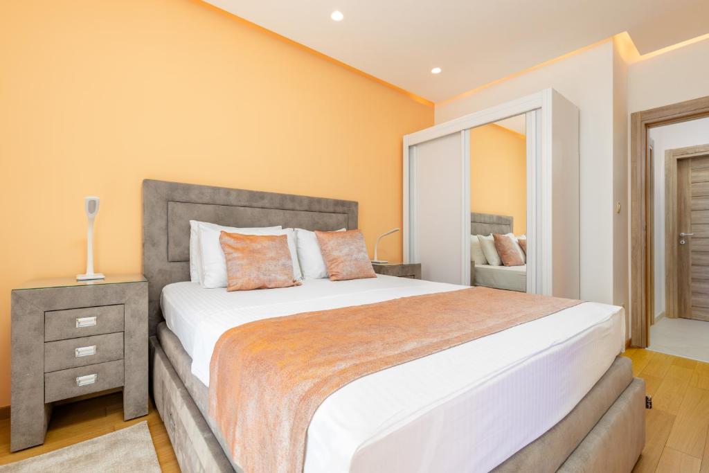 Postel nebo postele na pokoji v ubytování Apart hotel M S KATUNJANIN