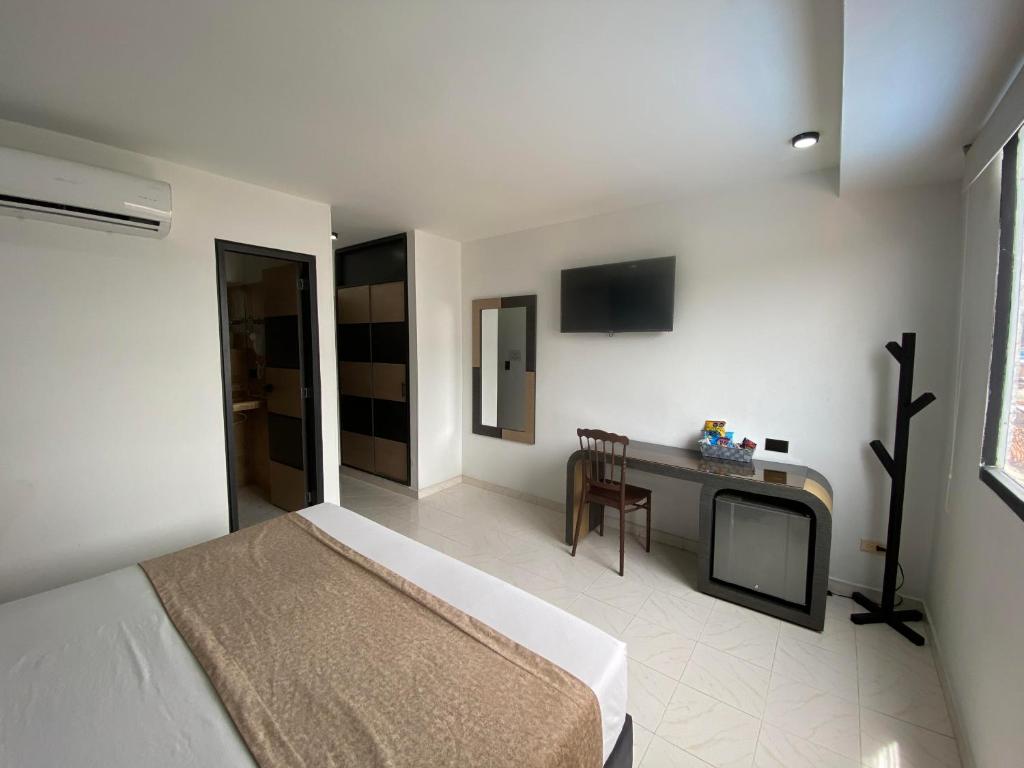 Postel nebo postele na pokoji v ubytování Hotel Plaza Real Ocaña
