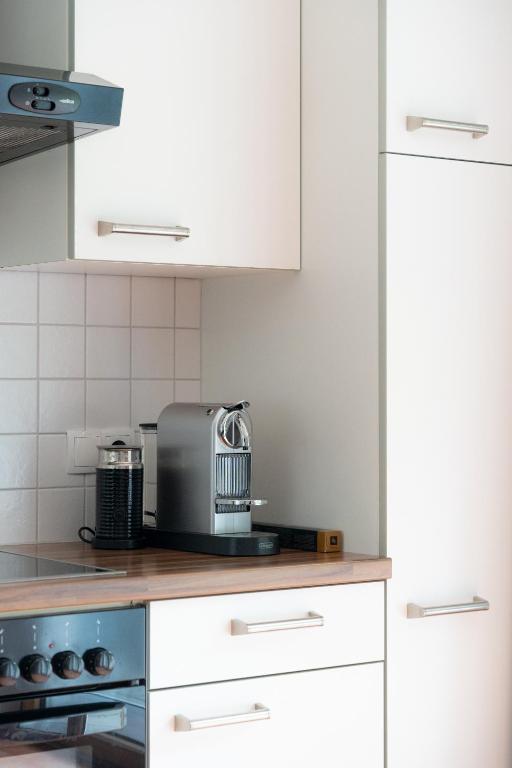 Kuchyň nebo kuchyňský kout v ubytování Appartements Wanner