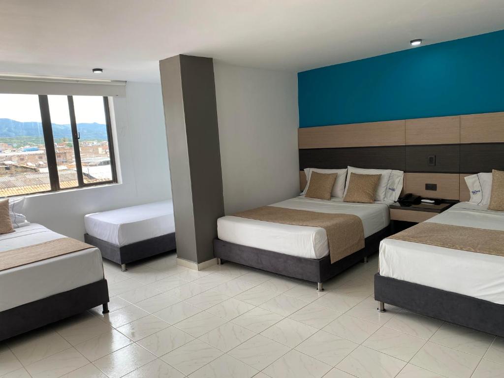 Postel nebo postele na pokoji v ubytování Hotel Plaza Real Ocaña