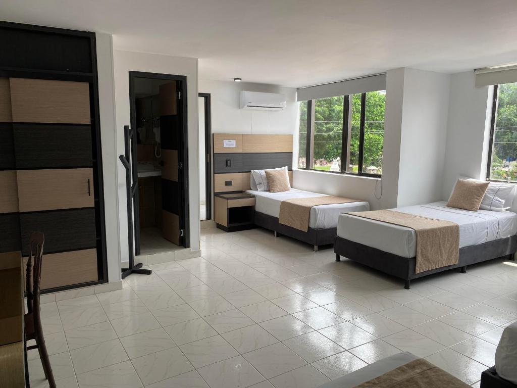 Postel nebo postele na pokoji v ubytování Hotel Plaza Real Ocaña
