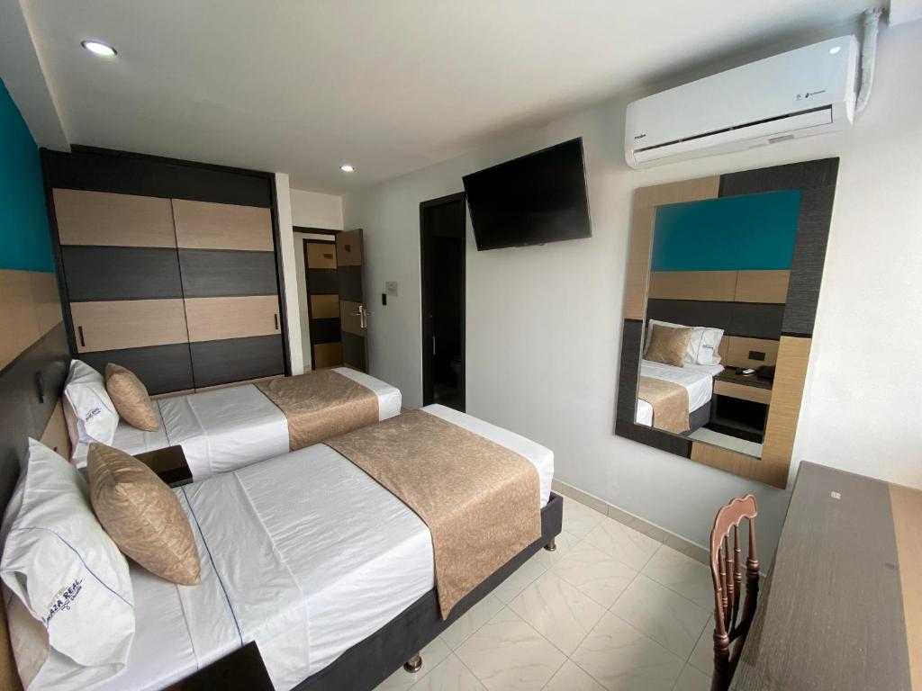 Postel nebo postele na pokoji v ubytování Hotel Plaza Real Ocaña