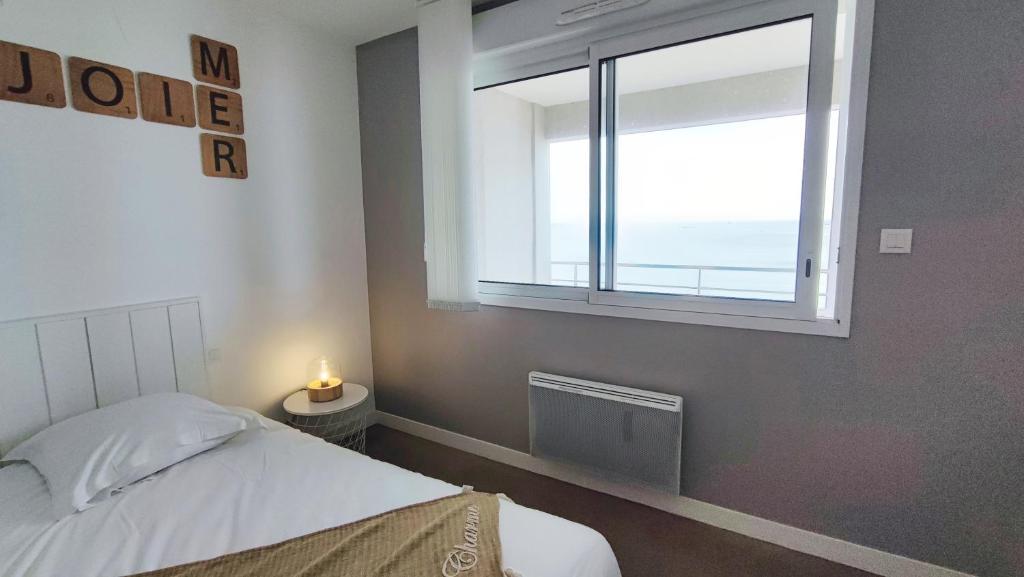 Photo de la galerie de l'établissement Rêve Bleu - Vue mer exceptionnelle - Wifi - draps et serviettes inclus - Balcon avec mobilier de jardin, à Penmarcʼh