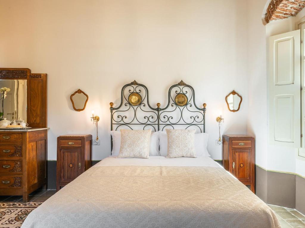 Postel nebo postele na pokoji v ubytování PALAZZO CHERCHI
