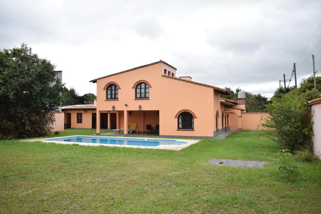 a house with a pool in front of it at Casa de Campo en Salta, Argentina. in Salta