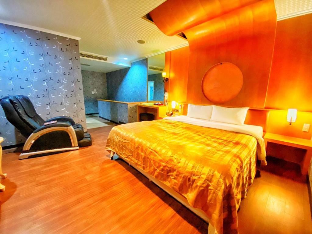 Postel nebo postele na pokoji v ubytování Hua Xiang Motel - Nanzih