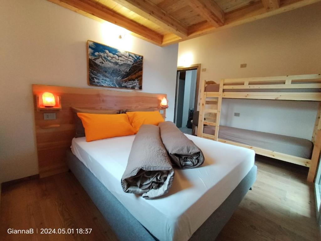 Postel nebo postele na pokoji v ubytování beb Aria di Montagna