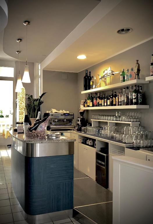 Kuchyň nebo kuchyňský kout v ubytování Hotel La Parigina