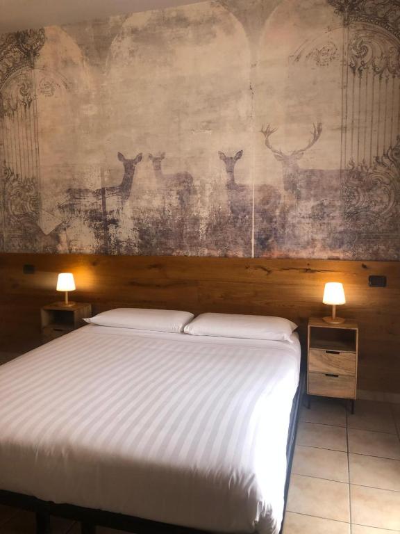 Postel nebo postele na pokoji v ubytování Locanda Da I Baldi