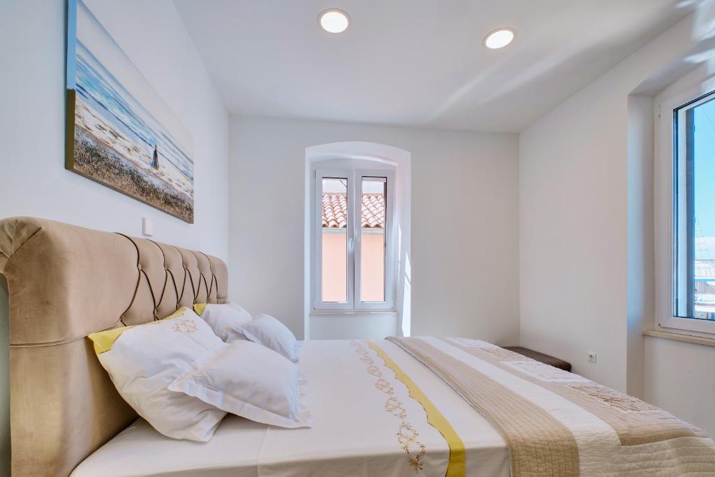 Postel nebo postele na pokoji v ubytování Apartman REGINA