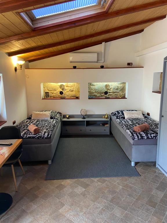 Postel nebo postele na pokoji v ubytování Vila Lucia - Apartmán 6