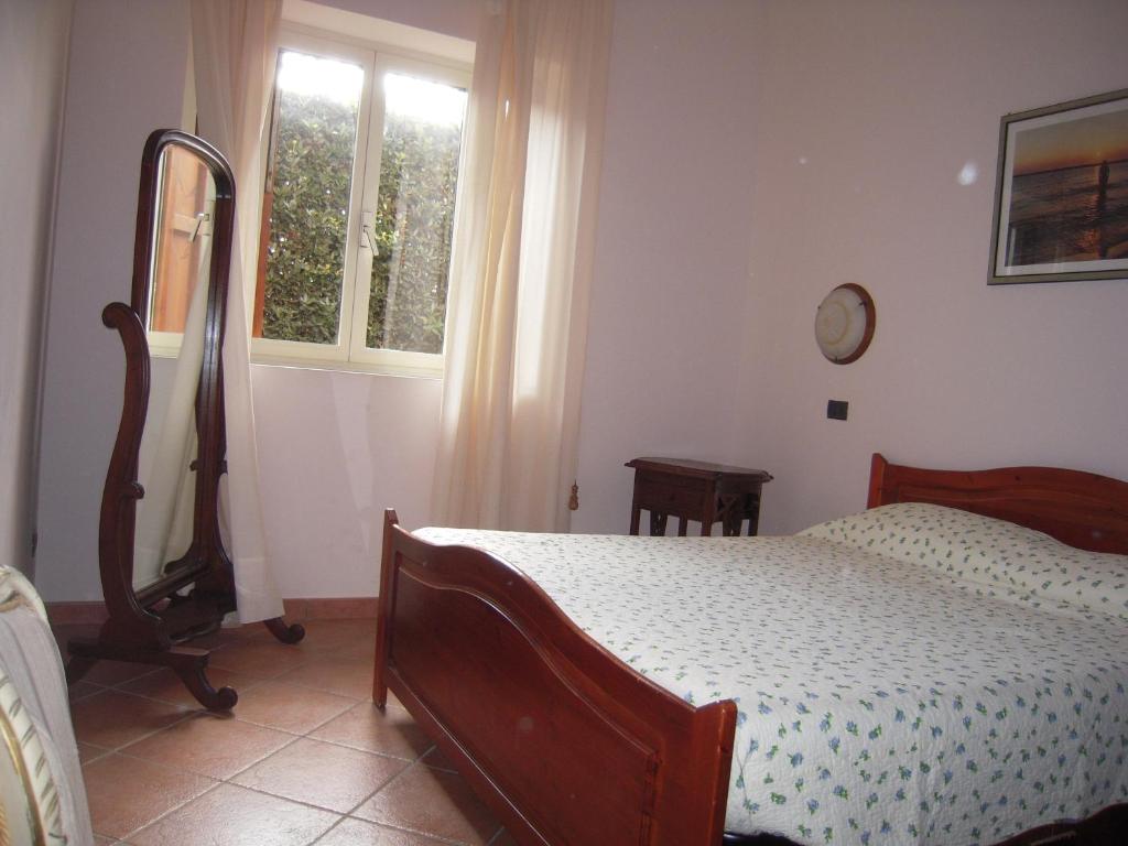 Łóżko lub łóżka w pokoju w obiekcie Agriturismo il Contadino