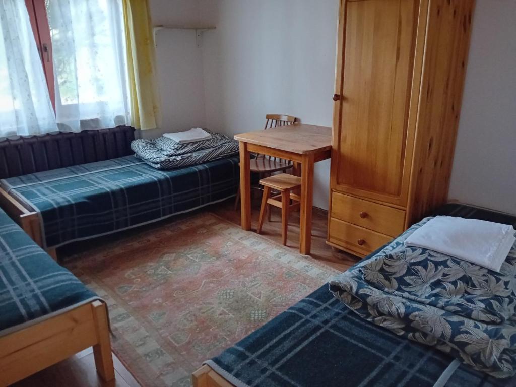Posteľ alebo postele v izbe v ubytovaní Pokoje Gościnne Za Sichłą