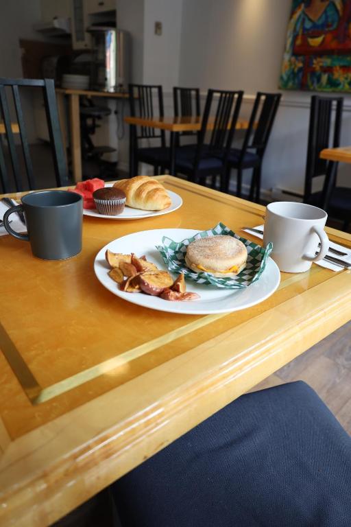 a table with a plate of breakfast food on it at ByWard Blue Inn in Ottawa