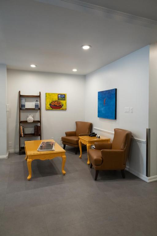a waiting room with two chairs and a table at ByWard Blue Inn in Ottawa