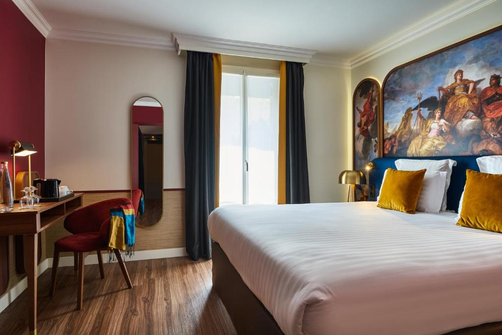 Un ou plusieurs lits dans un hébergement de l'établissement Hôtel Le Versailles