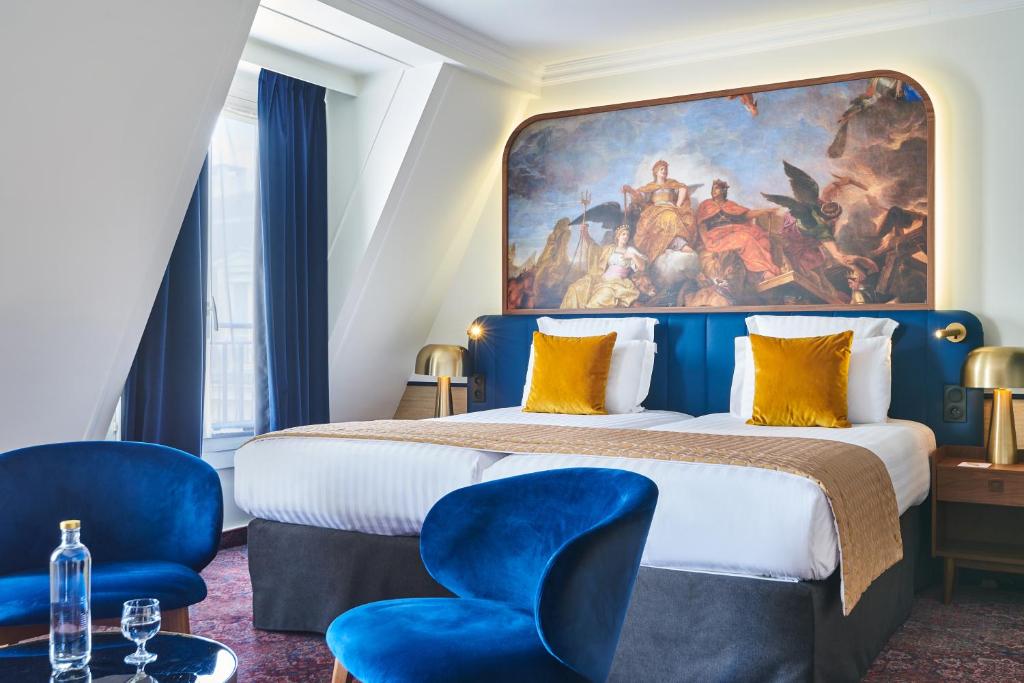 Un ou plusieurs lits dans un hébergement de l'établissement Hôtel Le Versailles