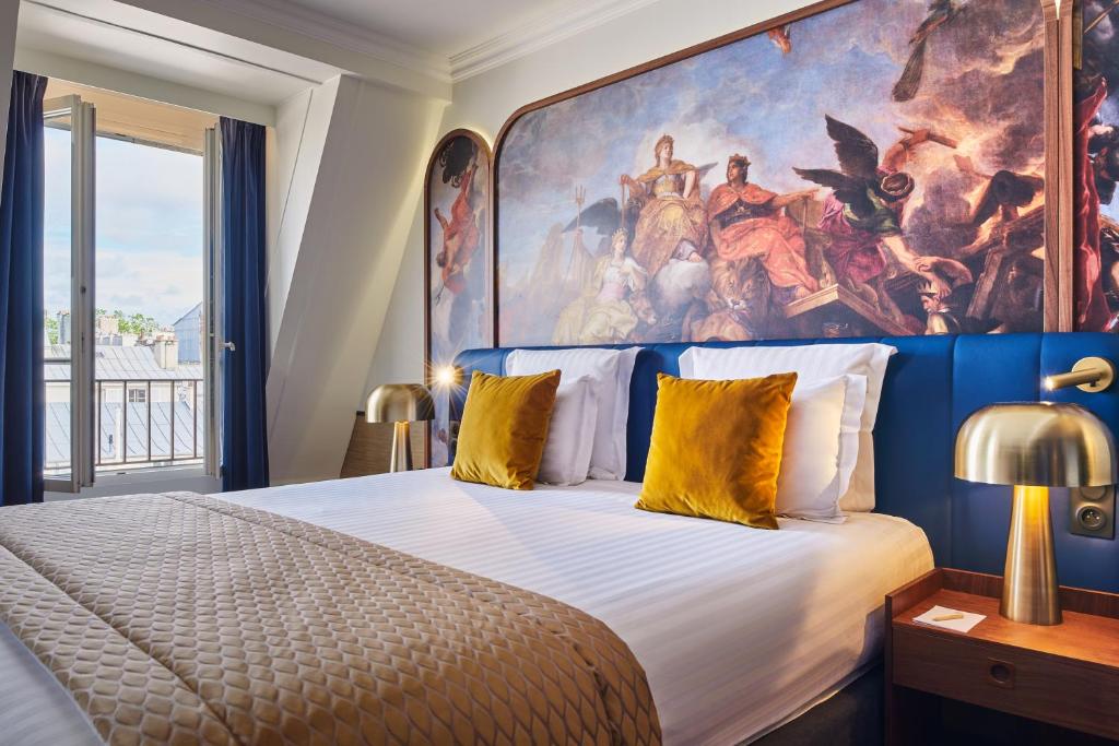 Un ou plusieurs lits dans un hébergement de l'établissement Hôtel Le Versailles