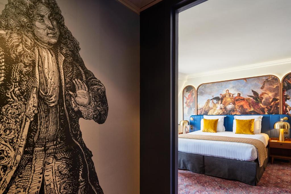Un ou plusieurs lits dans un hébergement de l'établissement Hôtel Le Versailles