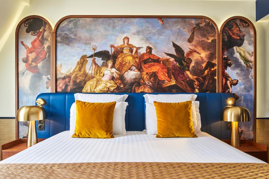Un ou plusieurs lits dans un hébergement de l'établissement Hôtel Le Versailles