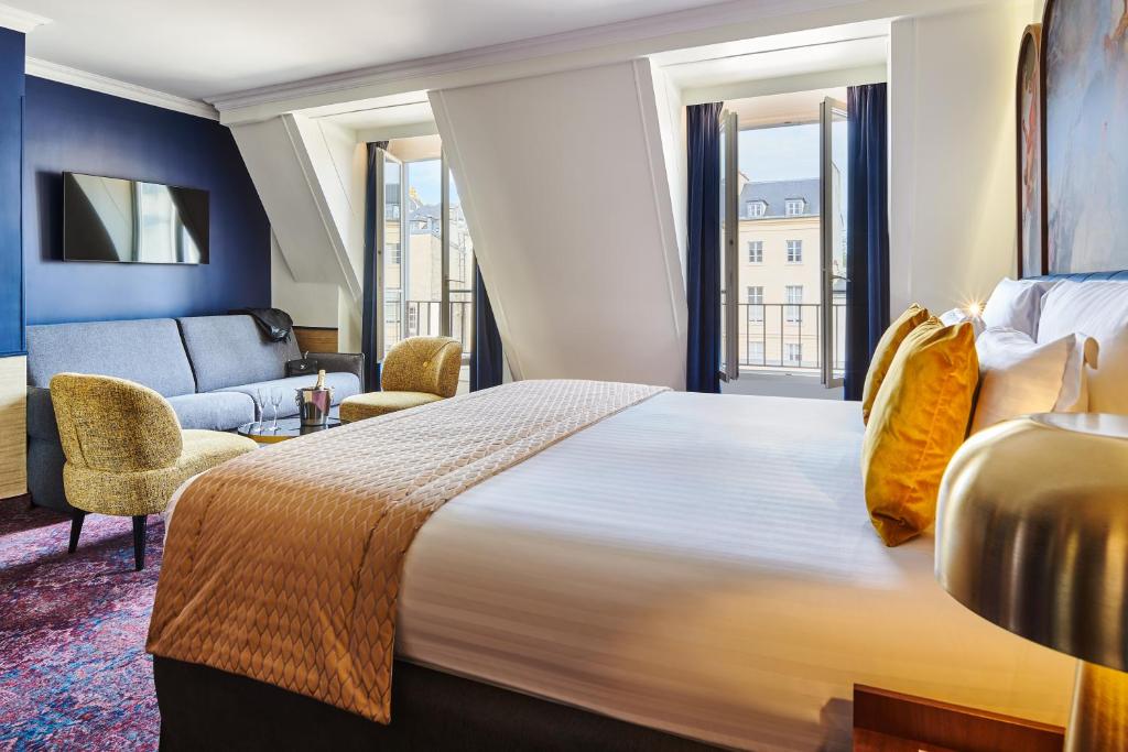 Un ou plusieurs lits dans un hébergement de l'établissement Hôtel Le Versailles