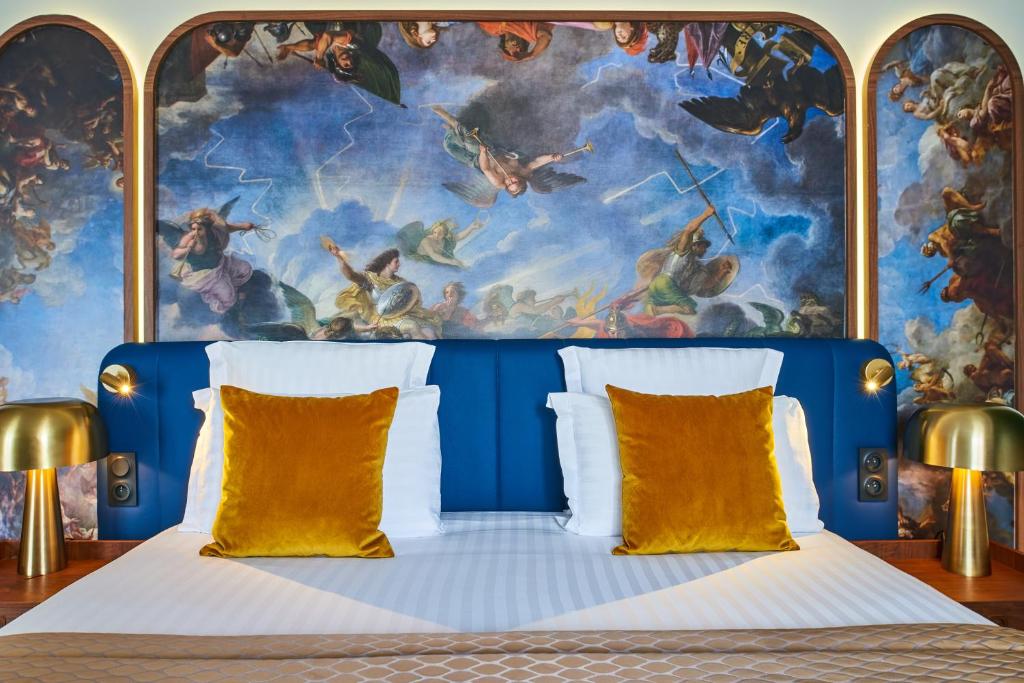 Un ou plusieurs lits dans un hébergement de l'établissement Hôtel Le Versailles