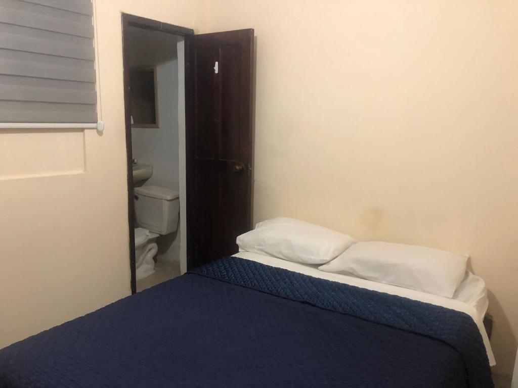 Postel nebo postele na pokoji v ubytování Veranera Hostal
