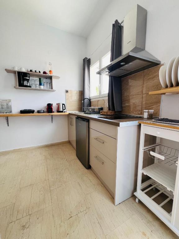 Kuchyň nebo kuchyňský kout v ubytování Yanna's Apartments
