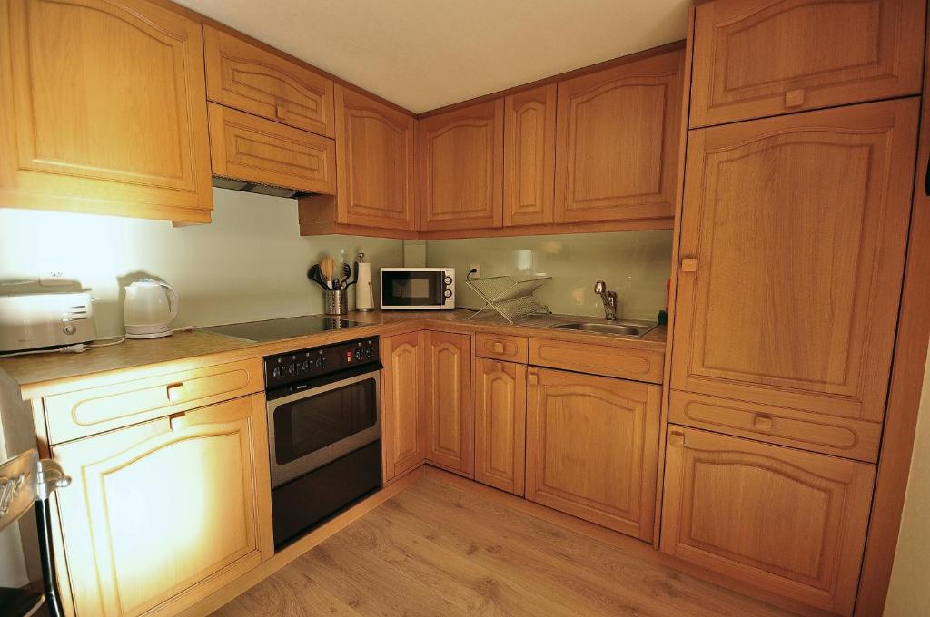 Kuchyň nebo kuchyňský kout v ubytování Seegärtli Riverside Apartment