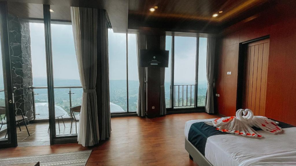 Damar Langit Resort客房内的一张或多张床位