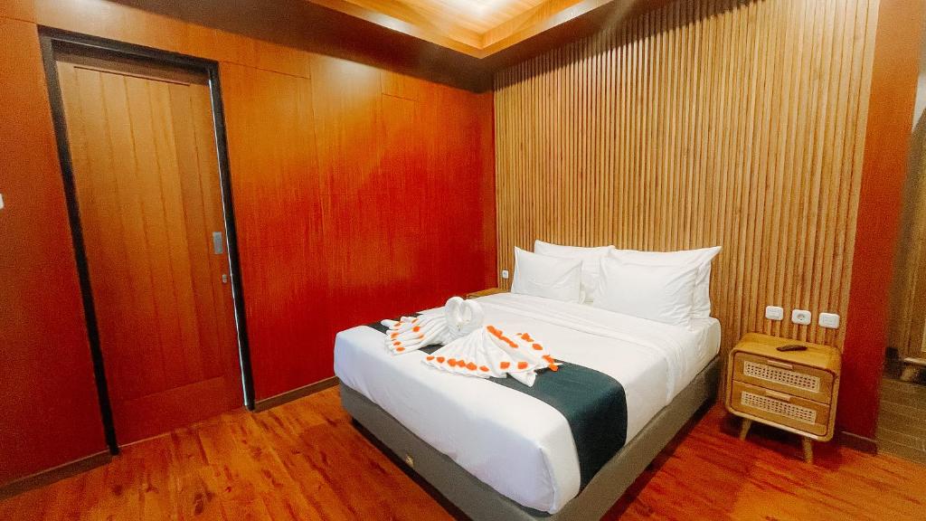 Damar Langit Resort客房内的一张或多张床位