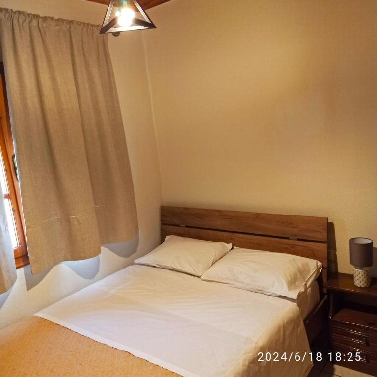 Postel nebo postele na pokoji v ubytování Geothan's House
