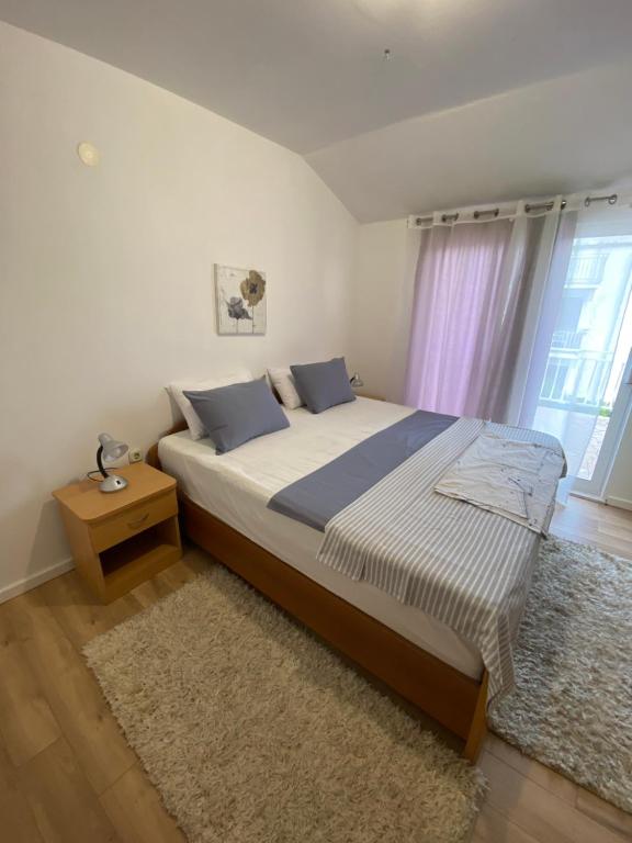 Posteľ alebo postele v izbe v ubytovaní Apartman Dubravka 2