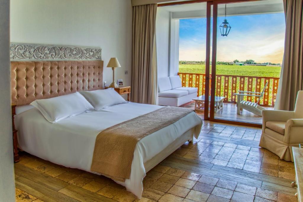 Postel nebo postele na pokoji v ubytování Hotel Viñas Queirolo