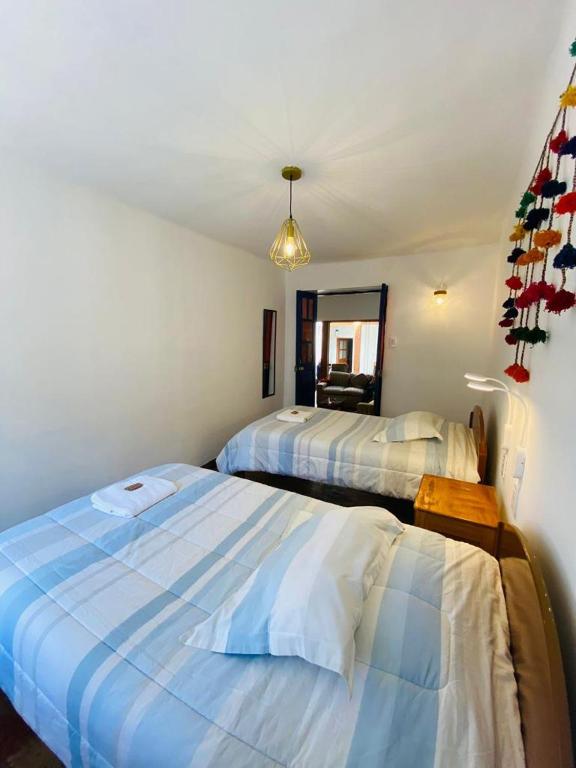 Rúm í herbergi á Flying Dog Hostel Cusco
