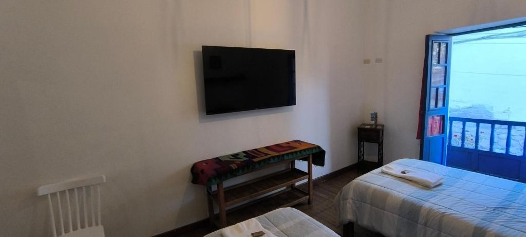 Rúm í herbergi á Flying Dog Hostel Cusco