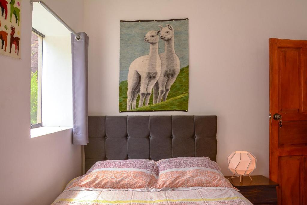 Postel nebo postele na pokoji v ubytování MANCHITAS WASI