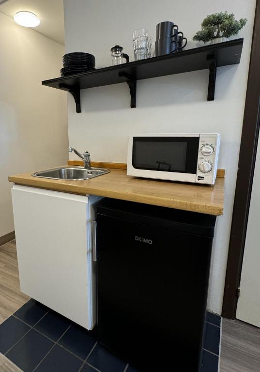 Kuchyň nebo kuchyňský kout v ubytování Day Dream L23 Guesthouse
