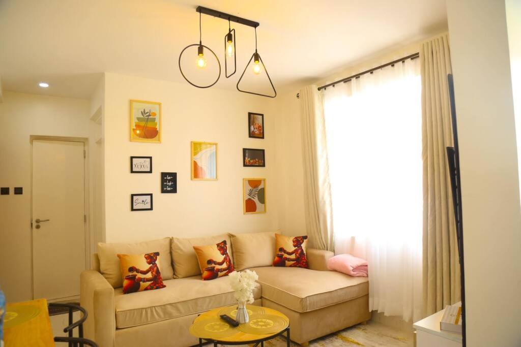 a living room with a couch and a table at Edenville Thindigua Kiambu road in Nairobi