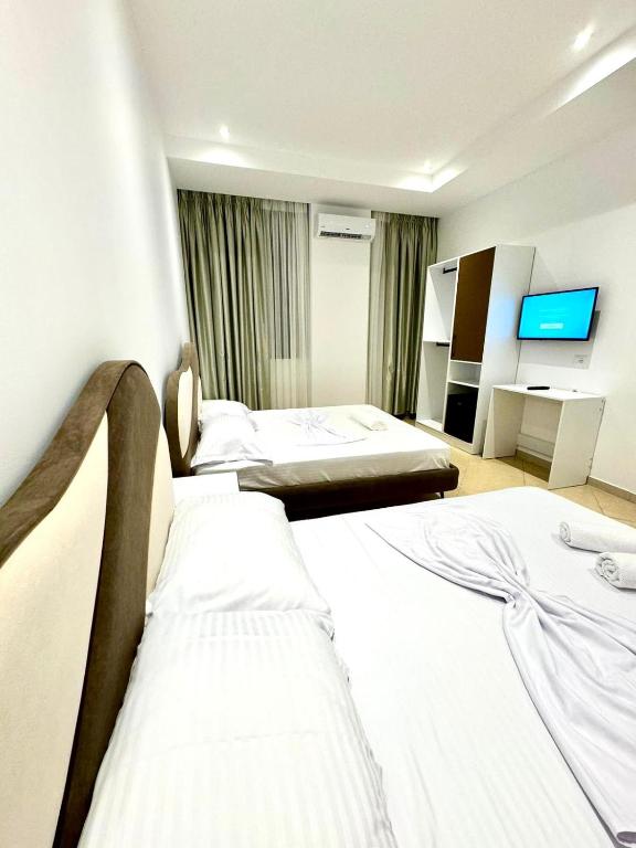 Postel nebo postele na pokoji v ubytování Hotel Balili