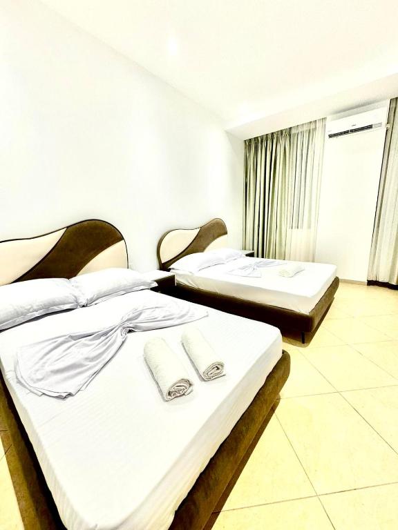 Postel nebo postele na pokoji v ubytování Hotel Balili