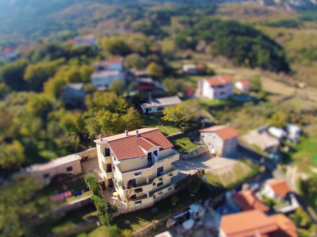 an overhead view of a house in a residential neighborhood at Apartments Sersic in Baška