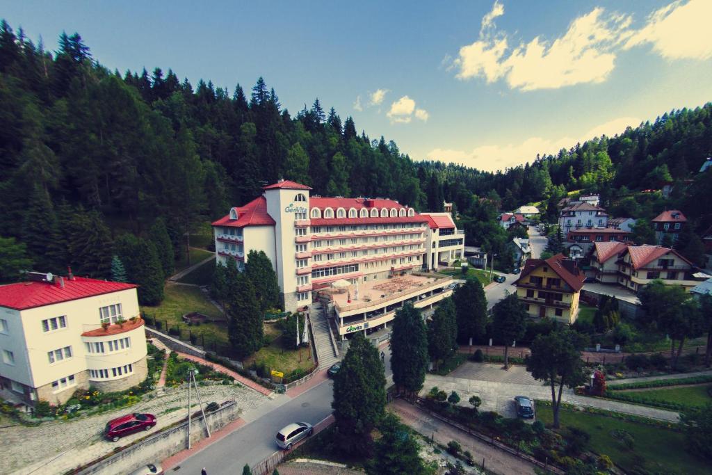 an aerial view of a large building in a town at Geovita Krynica-Zdroj in Krynica Zdrój