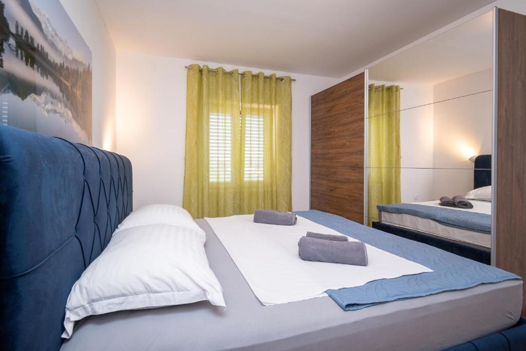 Postel nebo postele na pokoji v ubytování Apartment Dalmatino