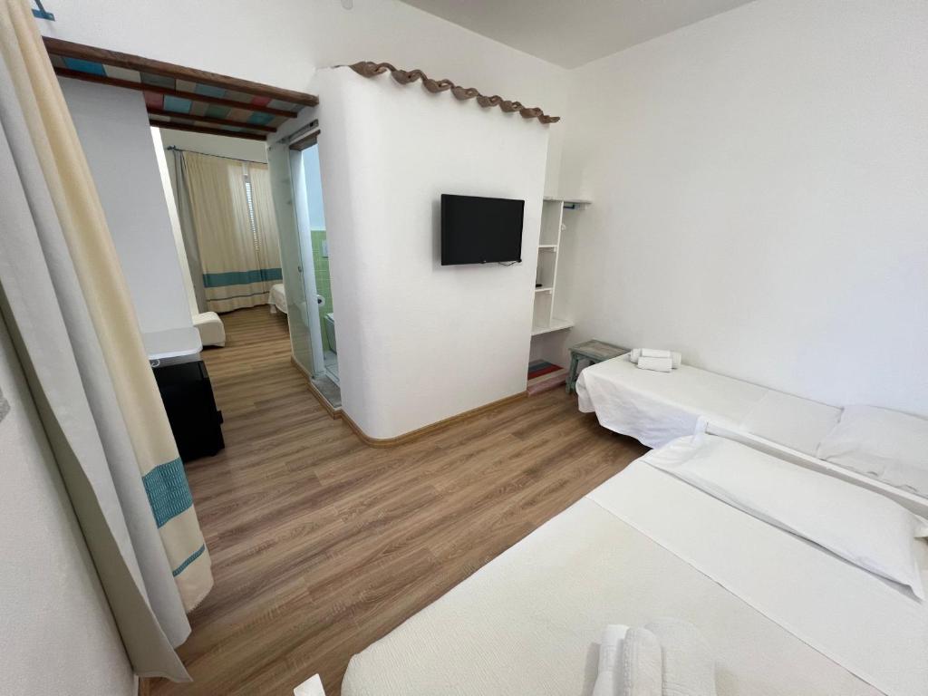 Postel nebo postele na pokoji v ubytování Hotel Da Cecco