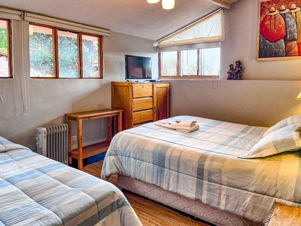 Rúm í herbergi á Flying Dog Hostel Cusco
