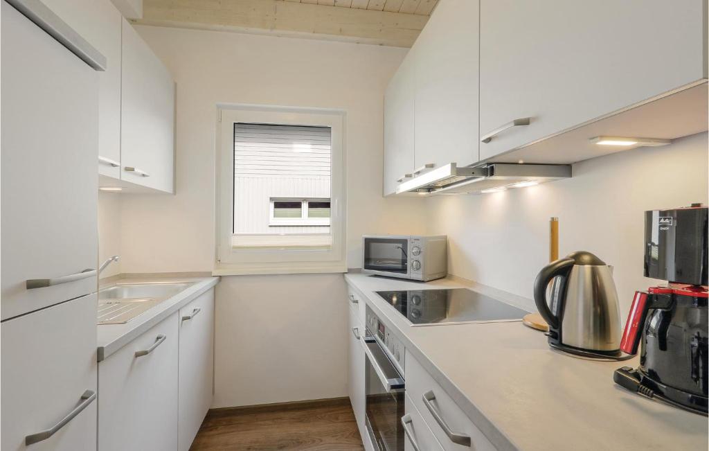 Kuchyň nebo kuchyňský kout v ubytování Ferienhausdorf Thale