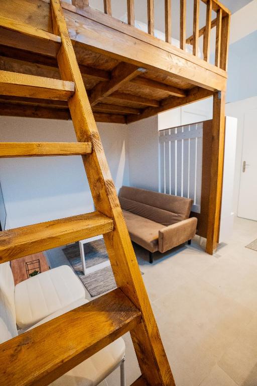 Ένα ή περισσότερα κρεβάτια σε δωμάτιο στο Studio cosy près de Paris et Disney