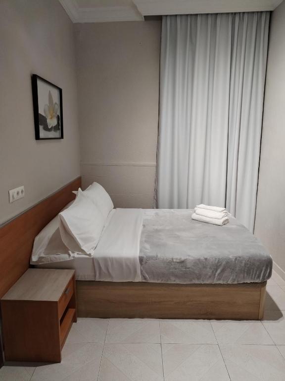 Postel nebo postele na pokoji v ubytování Pensión A&E